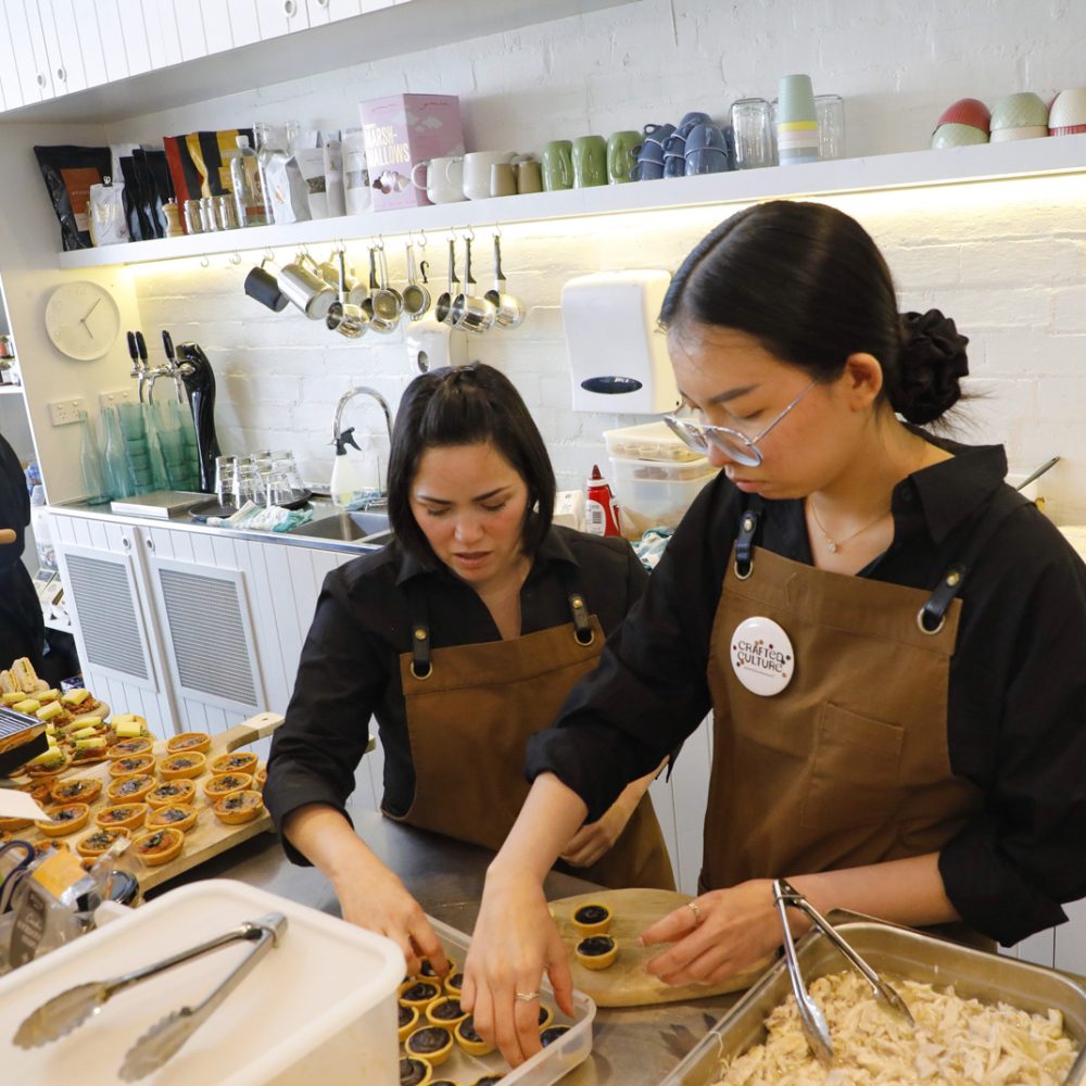 Sisters preparing for catering order